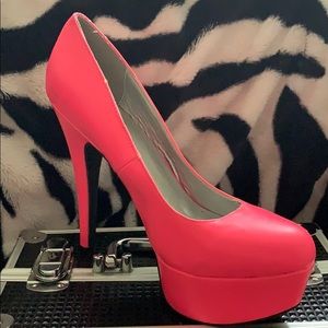 Hot pink platform pumps